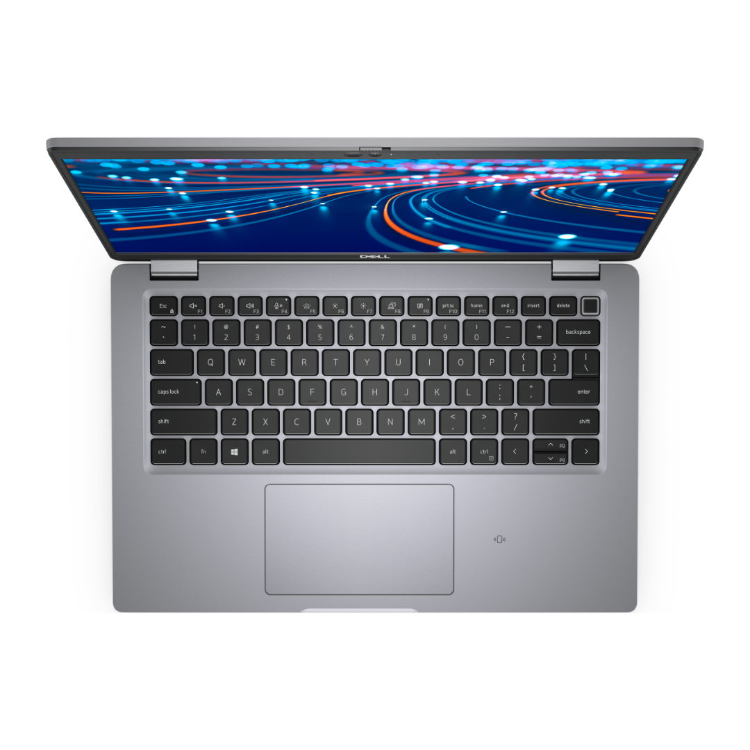A top-down view of a silver Dell laptop with its screen open, displaying a colorful abstract light pattern.